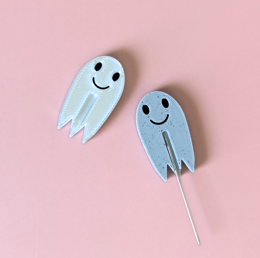 Ghost needle minders in whispy white and speckle, which is a dotted marble color.